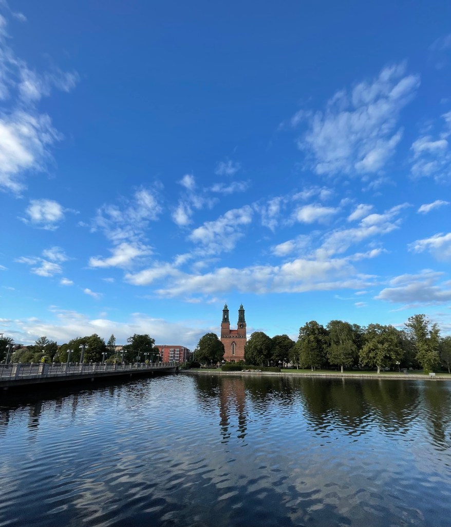 Panoramic view of Eskilstuna with the brick towers of Klosters kyrka reflected in the calm waters of Eskilstunaån
Classic Eskilstuna — Klosters kyrka standing proud by the river Eskilstunaån